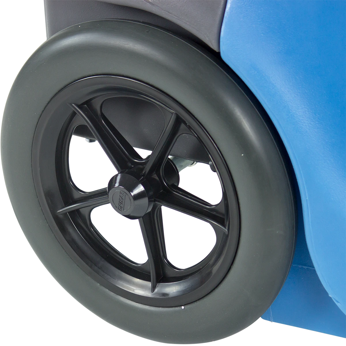 Close-up of a Driizair 1200 dehumidifier black wheel on a blue vehicle