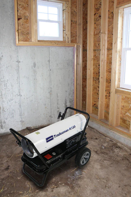 Heater Forced Air Kerosene 125K LB in a room with unfinished walls and floor