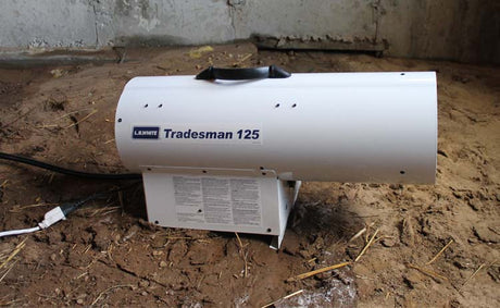 Heater Forced Air LP 125K BTU LB on a dirt floor.