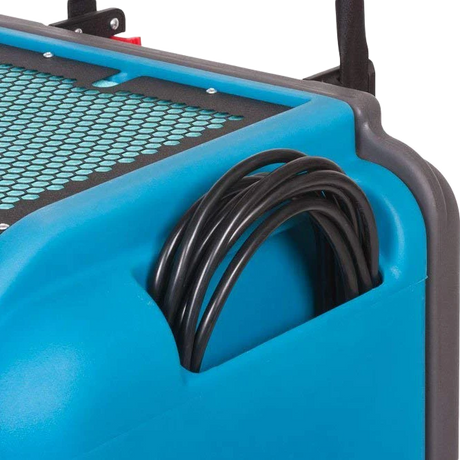 Blue and gray industrial dehumidifier with coiled black cable on a white background