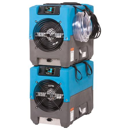 Blue and gray dehumidifier stacked on one another on a white background