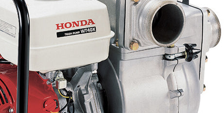 Honda engine with 'Honda' branding on a close-up of mechanical parts.